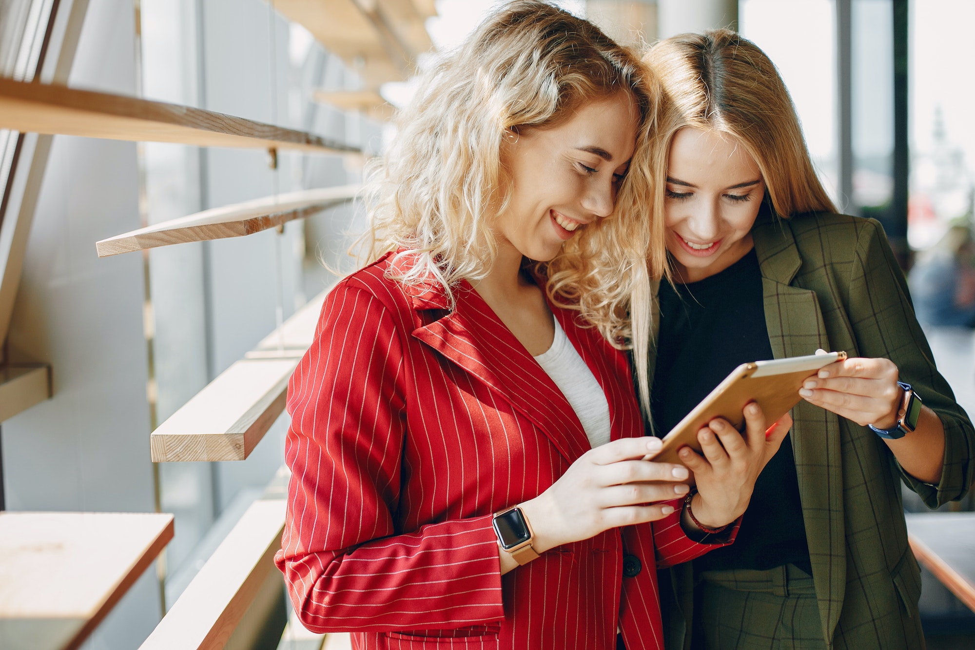 Two businesswomen working in a cafe